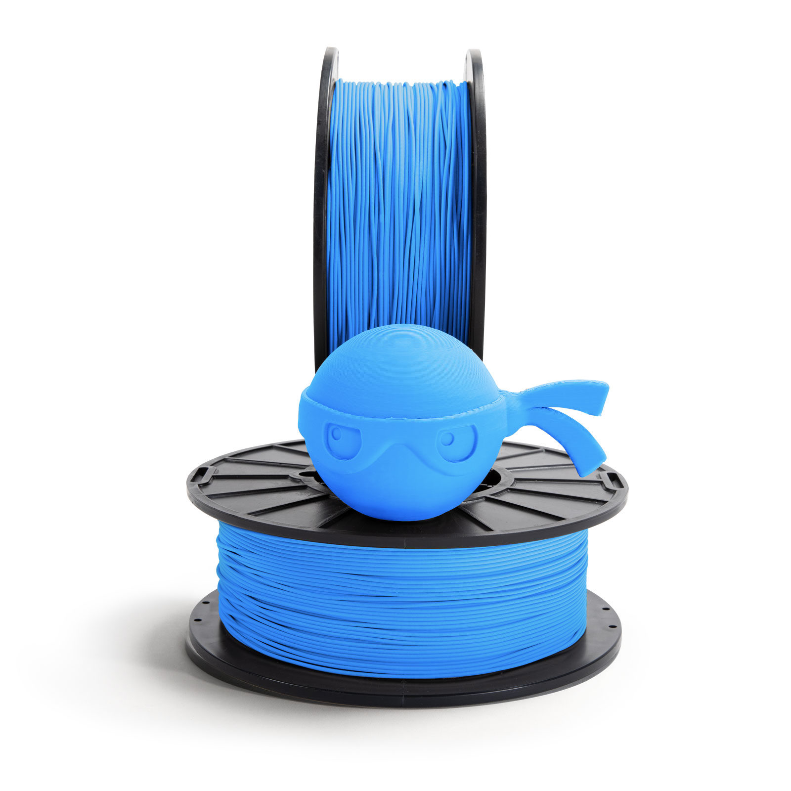 Sky blue ninja head sitting on NinjaTek 3D printing filament spool